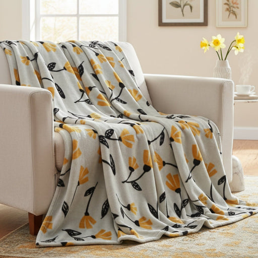 tulip Floral patterned blanket draped over a chair in a living room.