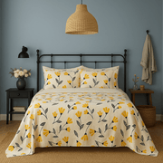 Bedroom with floral bedding, black metal bed frame, and decorative items. Sheet set with yellow tulips machine washable