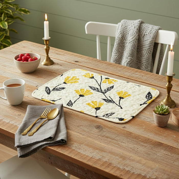 Wooden table setting with a floral placemat quilted
