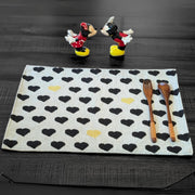tapestry placemat with black and yellow hearts