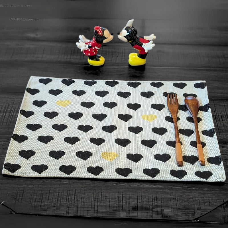 tapestry placemat with black and yellow hearts