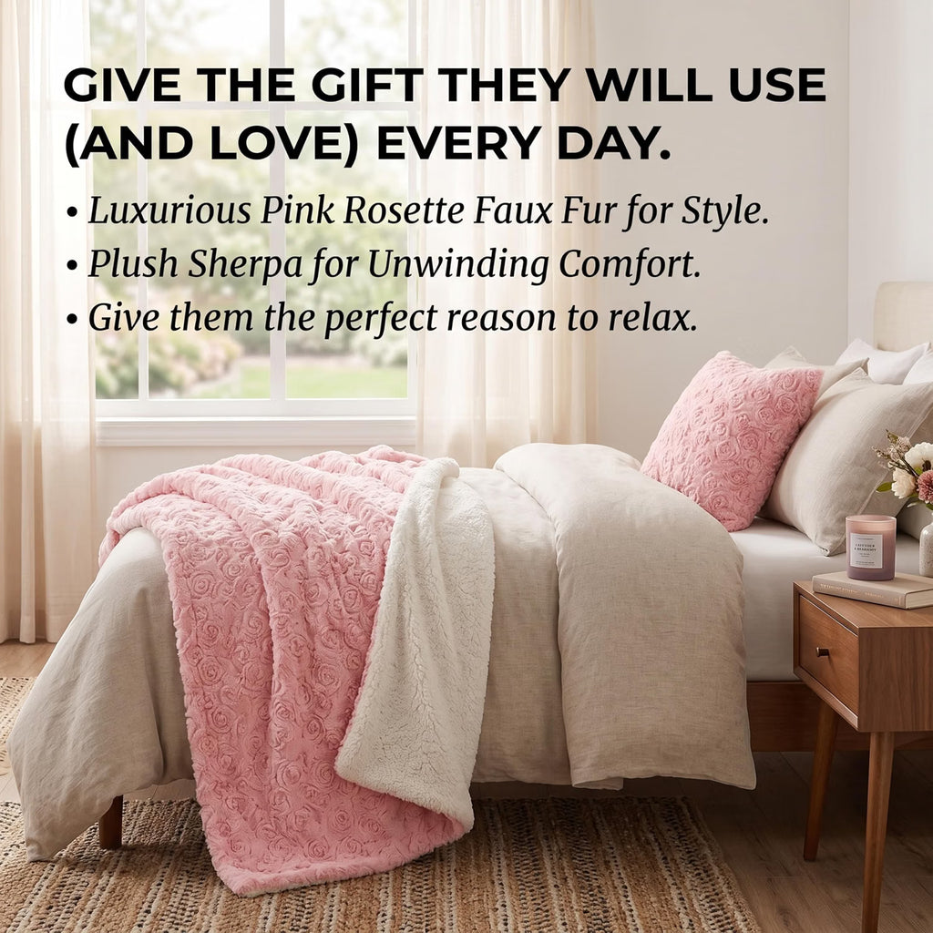 A styled bed in a bright bedroom setting with a pink textured faux fur throw blanket draped over cream bedding, plus matching pink pillows. Large promotional text appears on the left describing the pink rosette faux fur and plush sherpa comfort layers.