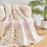 DaDalogy Cotton Patchwork Throw Blanket in blush pink and cream, floral quilted design, ruffled edges, 50 x 60.