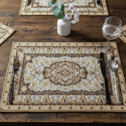 Decorative placemat with cutlery on a wooden table persian style tapestry placemat