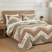 Bed with patterned bedding in a bedroom setting chevron duvet cover 