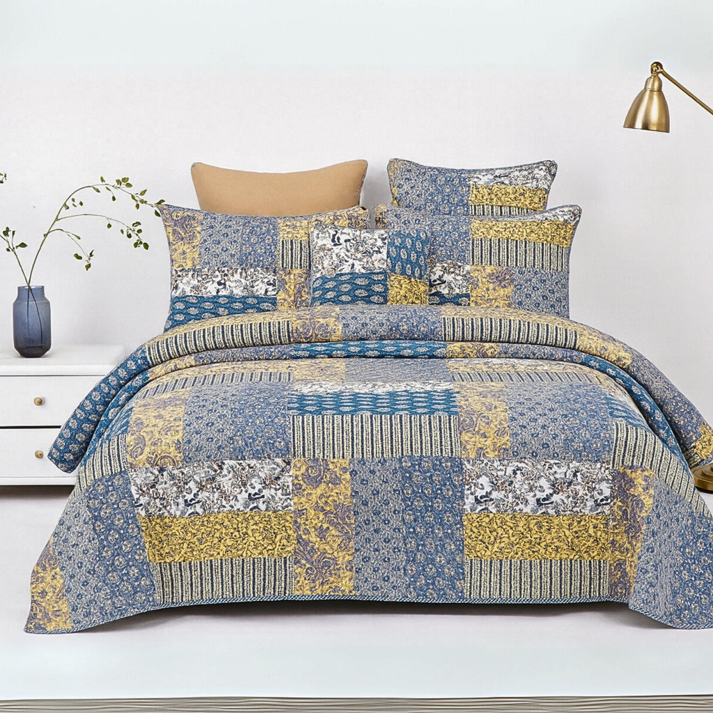 real Patchwork cotton quilt set on a bed. 