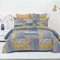 real Patchwork cotton quilt set on a bed. 