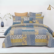 real Patchwork cotton quilt set on a bed. 