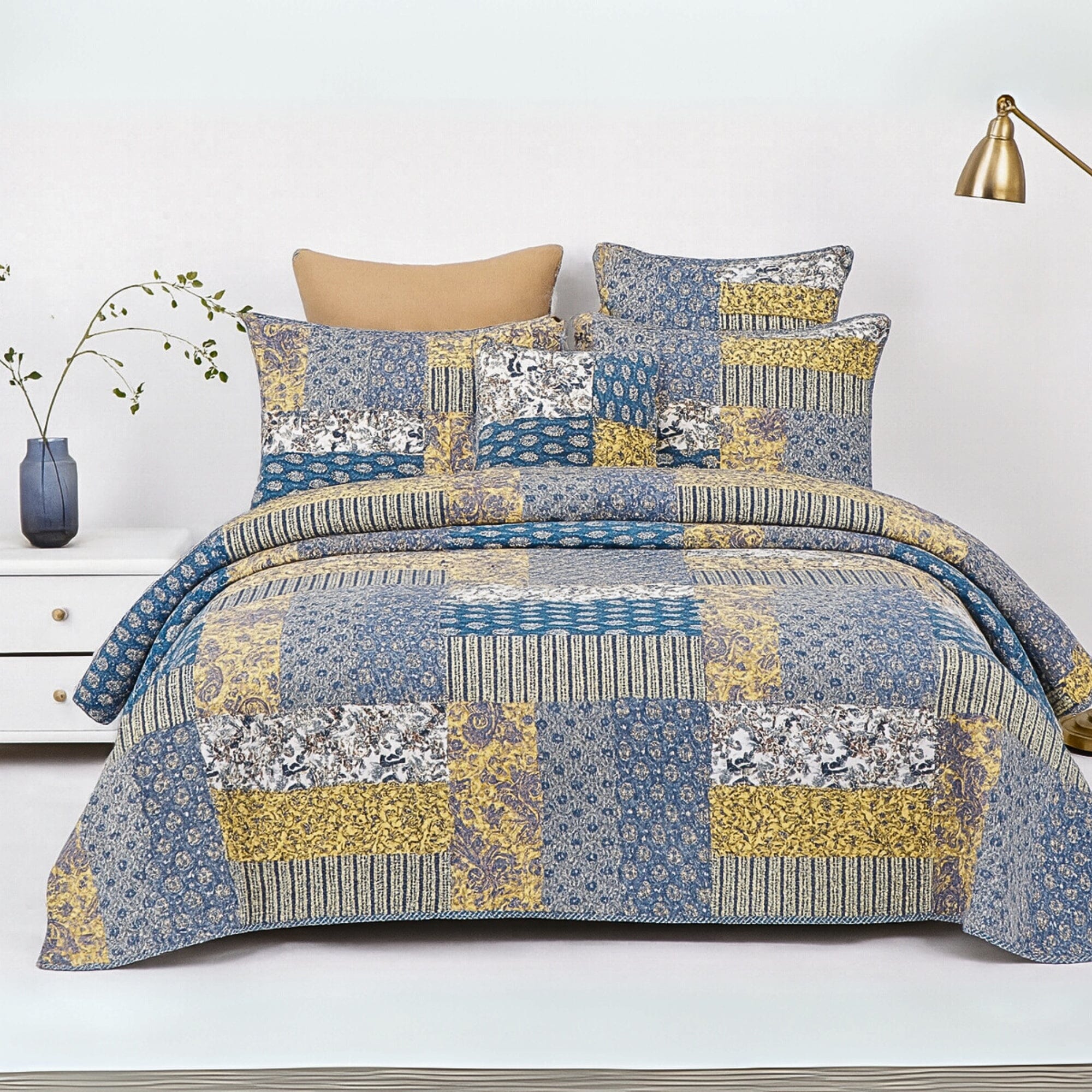 real Patchwork cotton quilt set on a bed. 