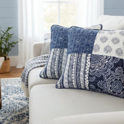 Boho farmhouse patchwork throw pillow covers 18x18 in navy blue, denim, white, and grey cotton with paisley and floral design on a sofa.