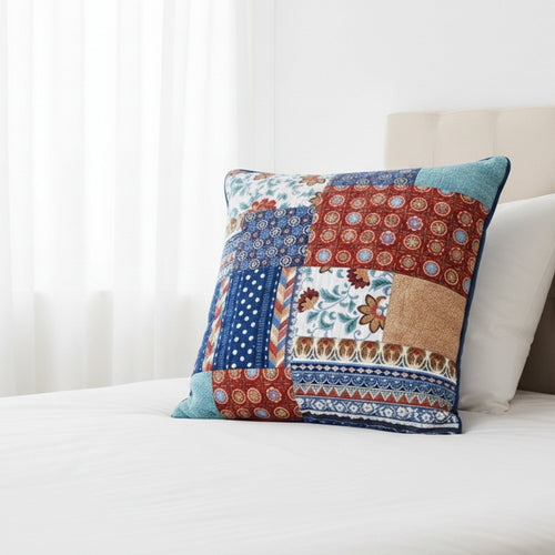 Colorful patchwork pillow 26x 26 euro sham on a white bed
