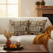 Cozy living room with patterned pillows, a blanket, and decorative items on a coffee table.