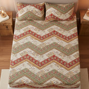 Deep pocket fitted sheet with chevron pattern on a bed in a bedroom setting