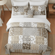 Patterned bedspread patchwork cotton quilt set on a bed in a bedroom setting