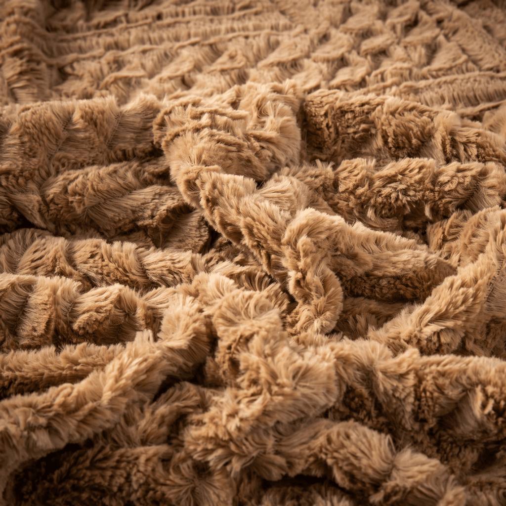 Cozy faux fur blanket detail in chocolate brown for winter bedding