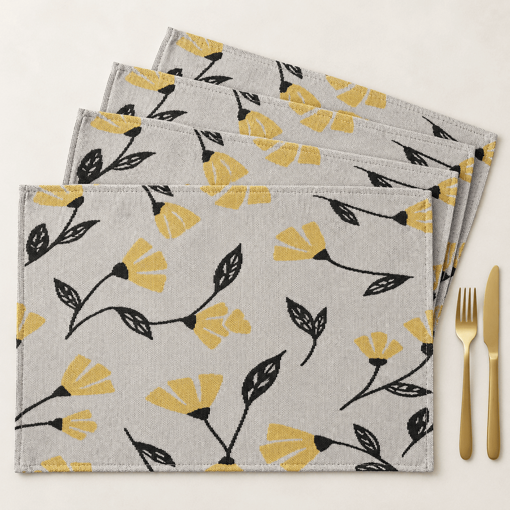 DaDa Bedding Set of 4 Yellow Fleur Spring Tapestry Placemats featuring a floral woven pattern displayed on a dining table setting with gold cutlery
