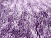 a close up of a purple purple flower 