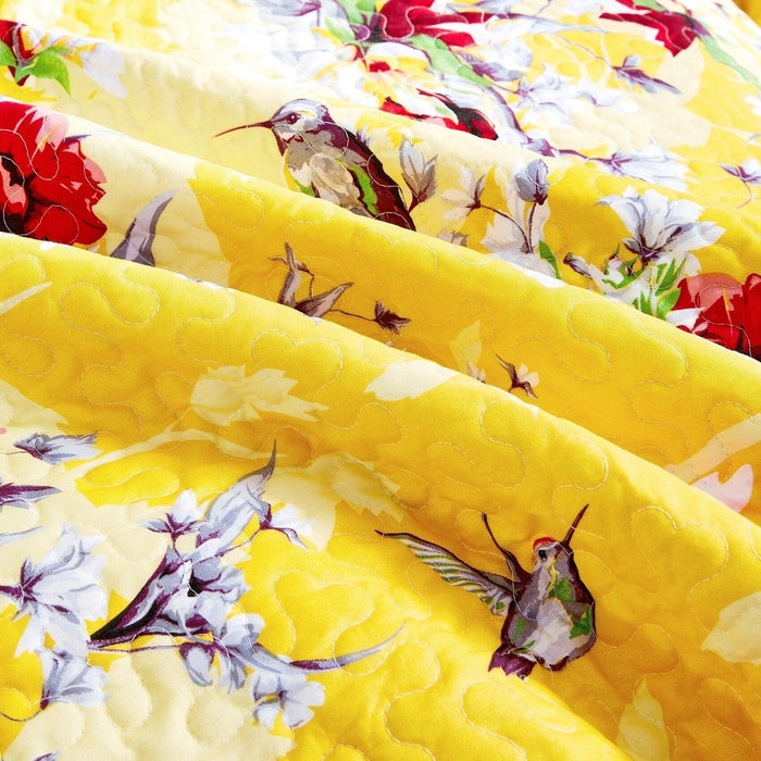 yellow bedspread set with shams and hummingbird design
