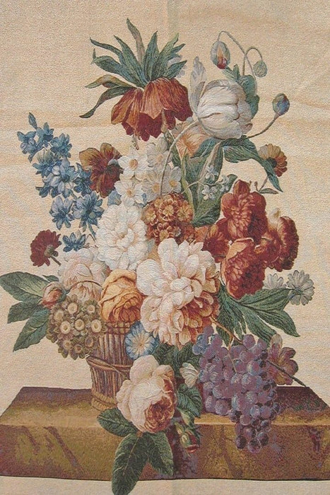 a vase filled with lots of different colored flowers 